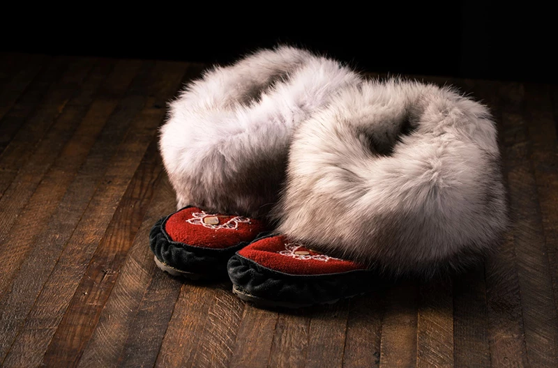 Designed Moccasin with a red background and furry tops